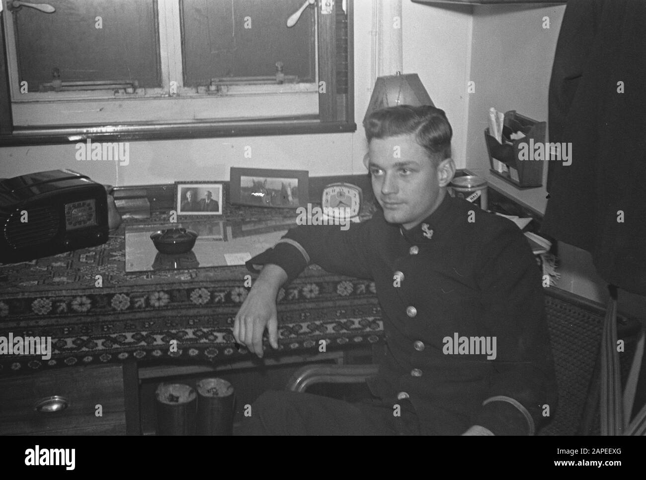 MN [Merchant Navy]/Anefo London series Description: [Crew member of Dutch merchant ship in cabin] Date: May 10, 1943 Location: Great Britain Keywords: merchant fleets, navy, officers, ships, World War II Stock Photo