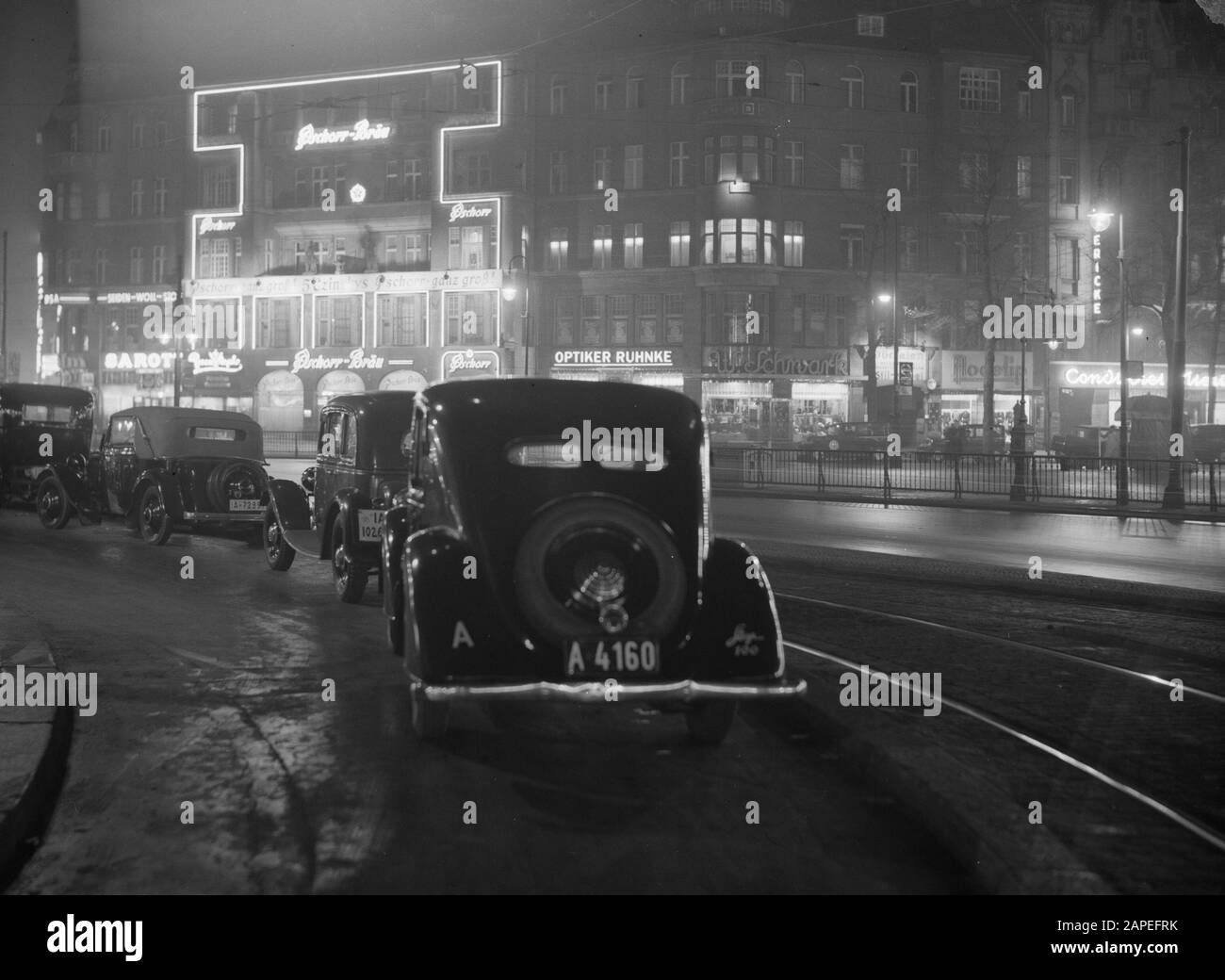 Reportage Berlin Description: Berlin. Night shooting of the Tauentzienstrasse with the illuminated facade of the cafe-restaurant Pschorr-Brau and packed cars Date: November 1935 Location: Berlin, Germany Keywords: cafes, advertising, restaurants, cityscape Stock Photo