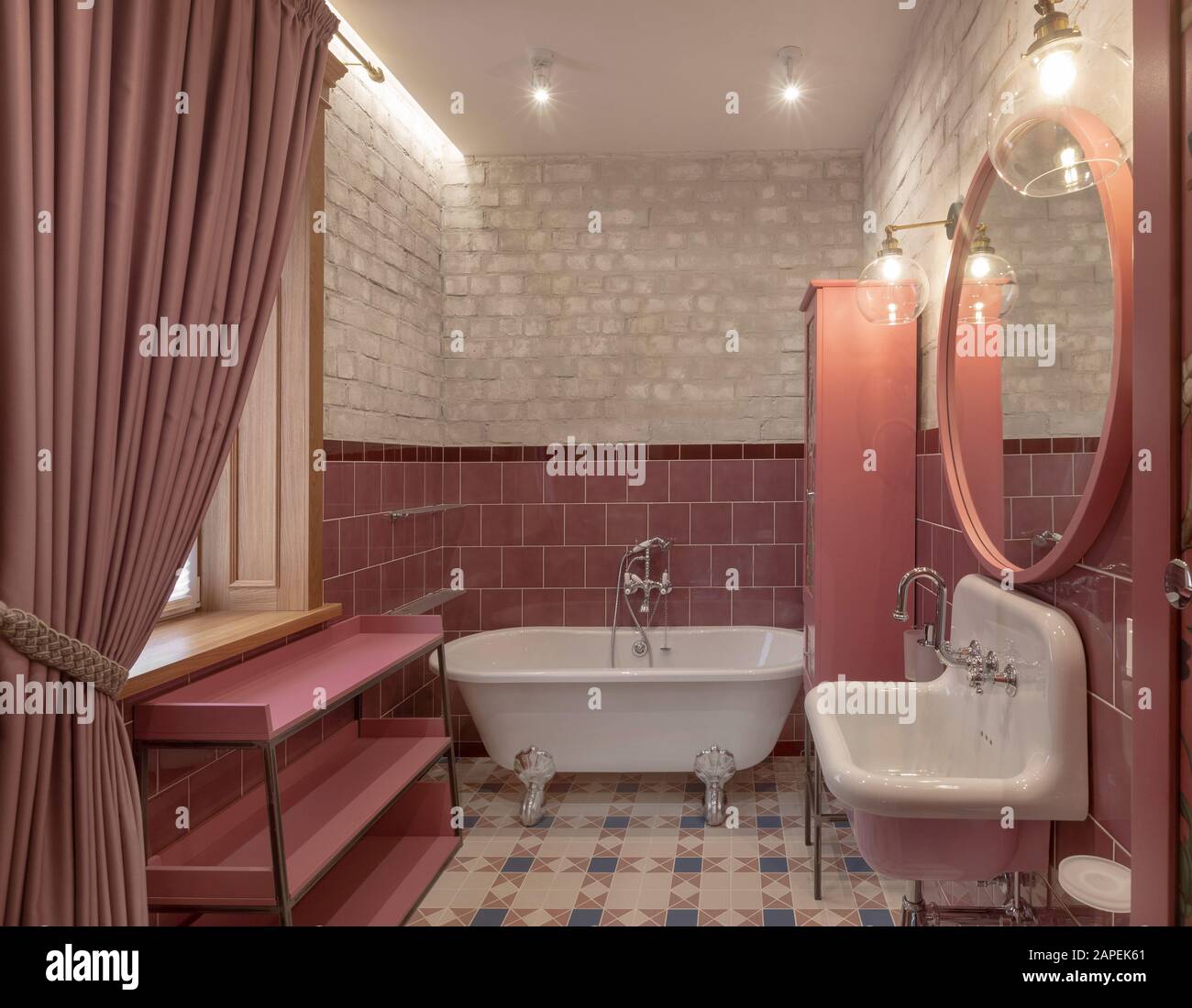 Elegant bathroom with modern design in pink color Stock Photo - Alamy