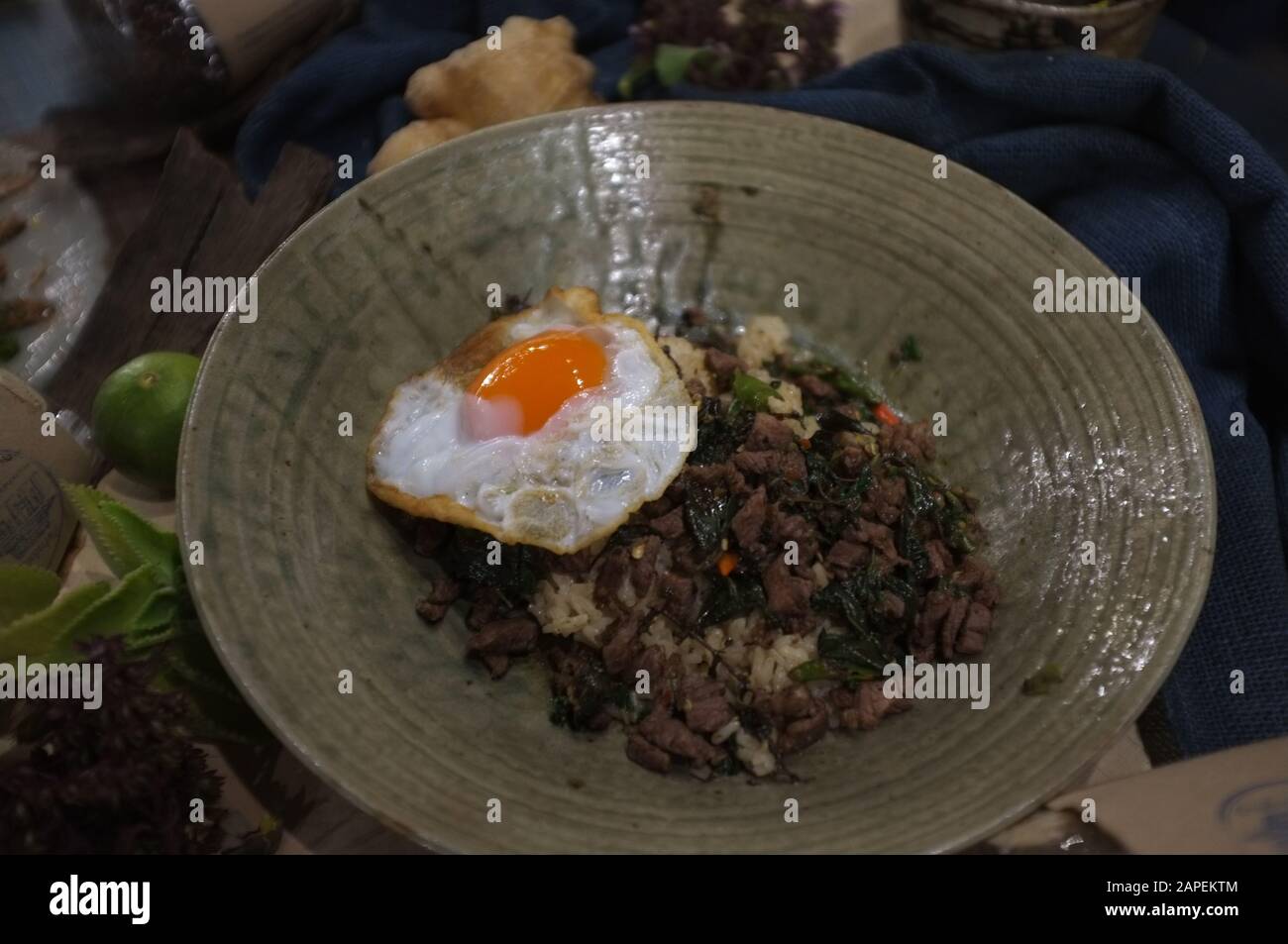 Rice topped with stir-fried beef and basil and fried egg , Concept healthy food , organic food Stock Photo