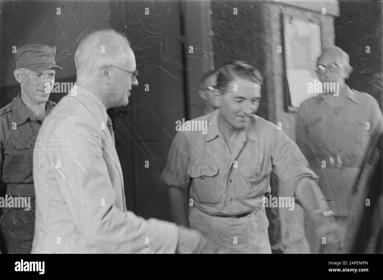 Visit of Prof. Carl Romme to Semarang Description: Visit to II-6 R.I. Dr. C.P.M. Romom (in white jacket) gets explanations from officers Date: 17 January 1946 Location: Indonesia, Java, Dutch East Indies, Semarang Personal name: Romme, C.P.M. Stock Photo