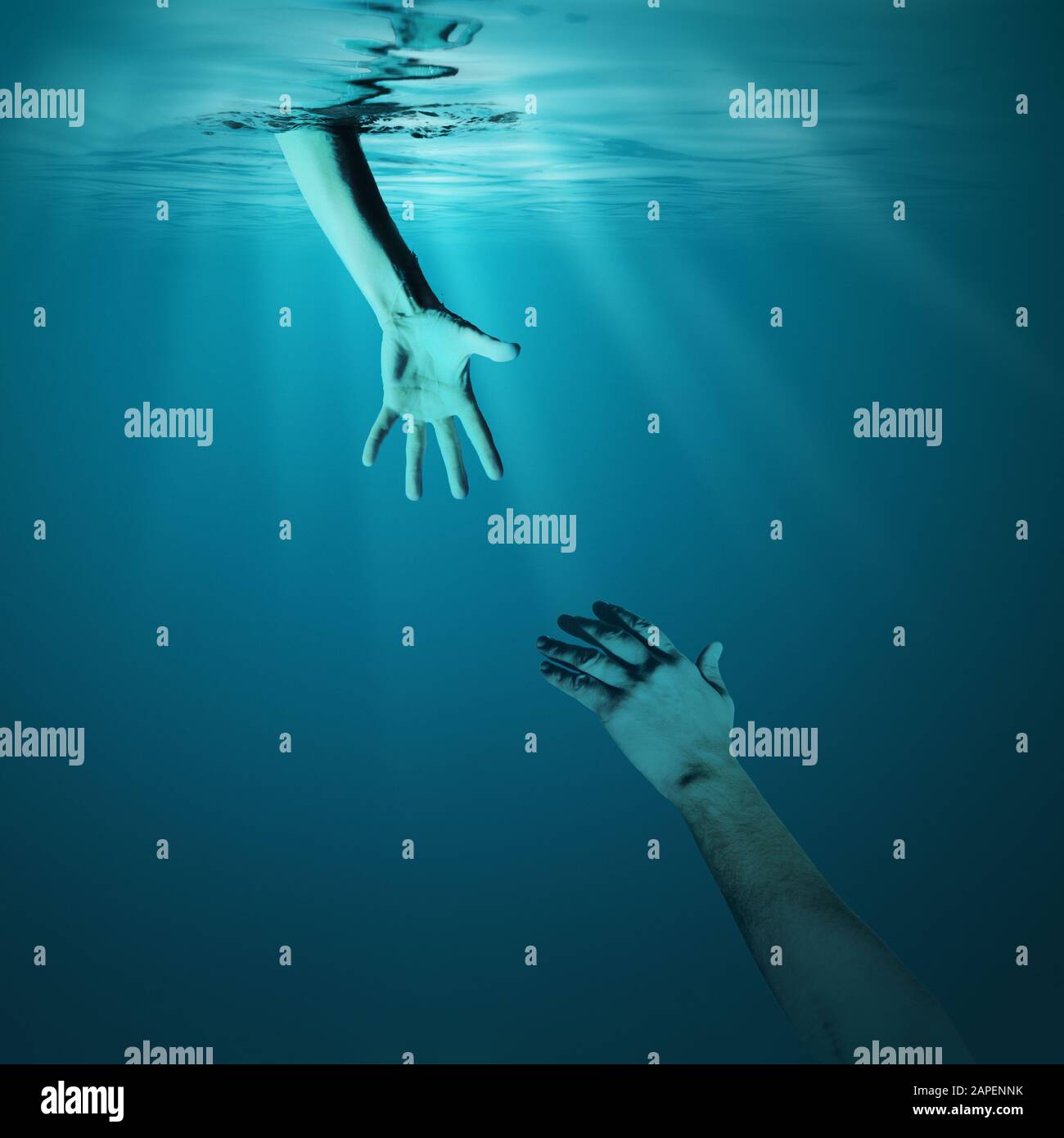 Problem solving concept. Giving helping hand in sea underwater. Stock Photo