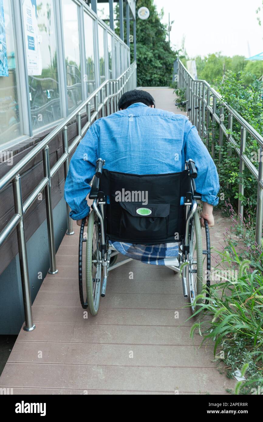 Wheelchair uphill hires stock photography and images Alamy