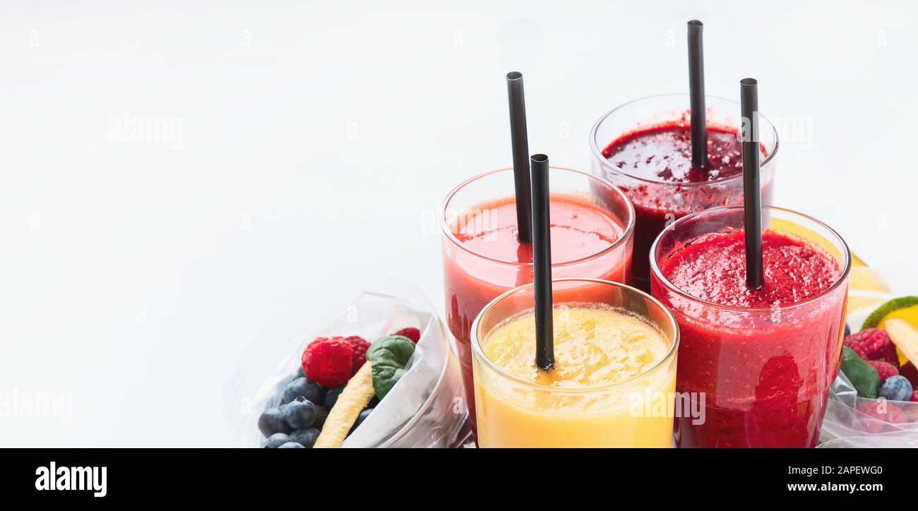 Htalthy fresh fruit and vegetable smoothies with assorted ingredients served in packs. Image with copy space Stock Photo