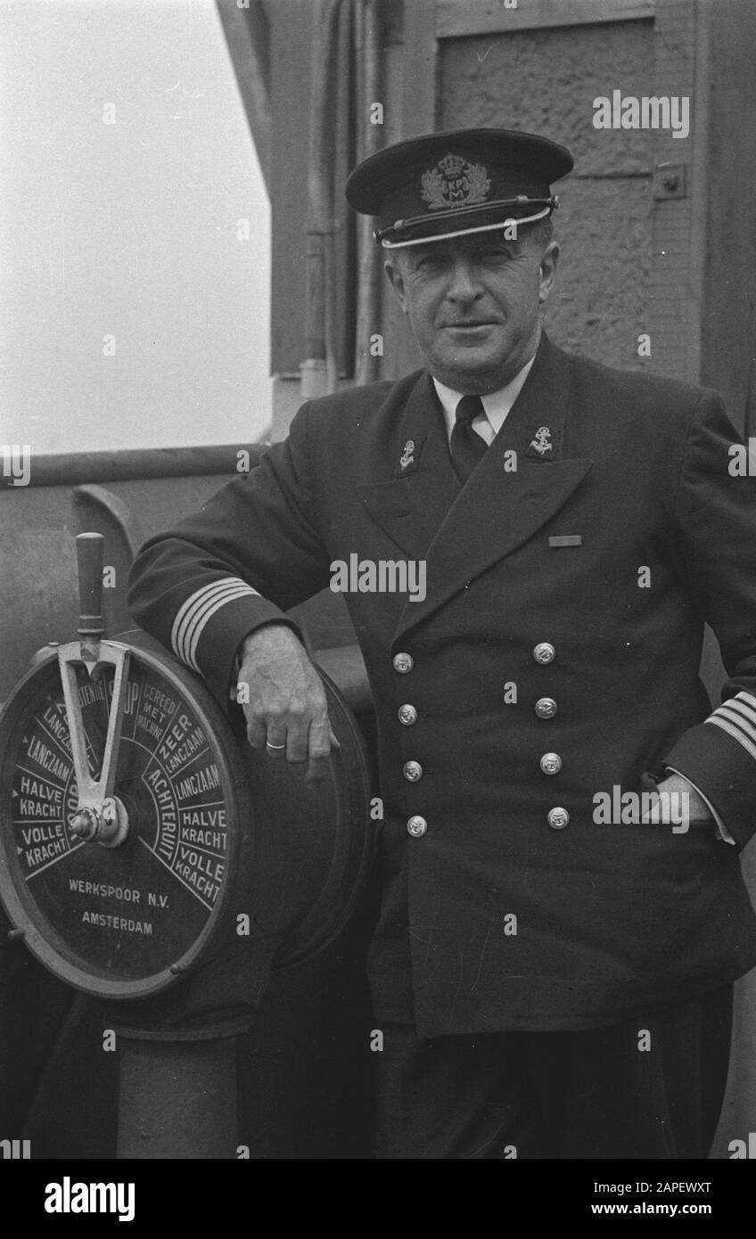 MN [Merchant Navy]/Anefo London series Description: Caption: The captain who was recently decorated for an act of heroism, the nature of which may not be disclosed at the present [Captain who has been awarded for a certain heroic act, which can not yet be disclosed] Annotation: Probably Captain A. Dubois of the M.S. Dempo, who was awarded the Distinguished Service Cross for his contribution to Operation Torch, the landings on North Africa in 1942 Date: June 1943 Location: Great- Britain Keywords: crew, merchant fleets, navy, tugs, World War II Stock Photo