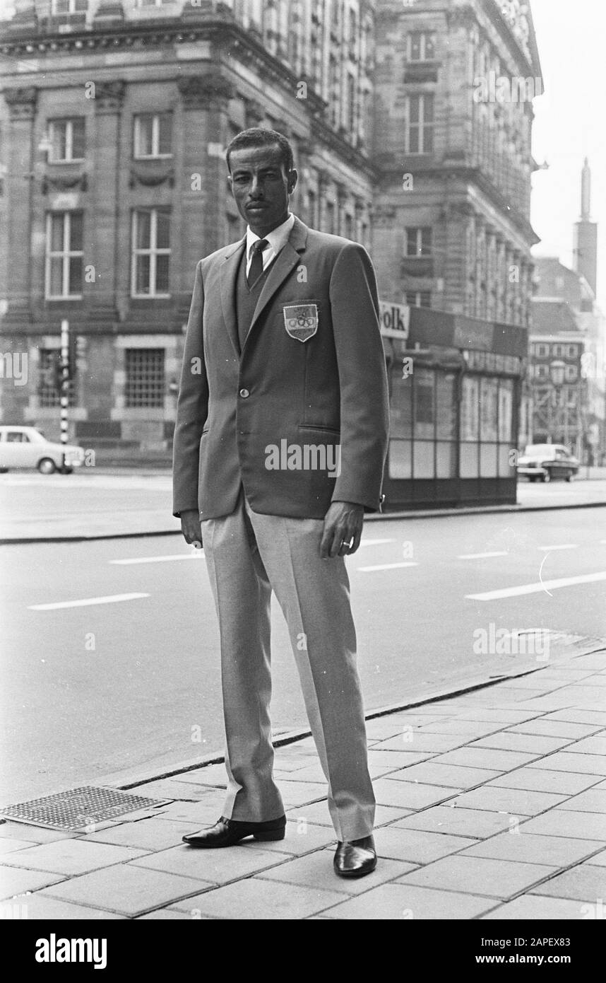 The Olympic marathon champion, the Ethiopier Abebe Bikila is in Amsterdam Description: Bikila poses on the street Date: 22 September 1968 Location: Amsterdam, Noord-Holland Keywords: marathon, portraits Personal name: Bikila, Abebe Stock Photo