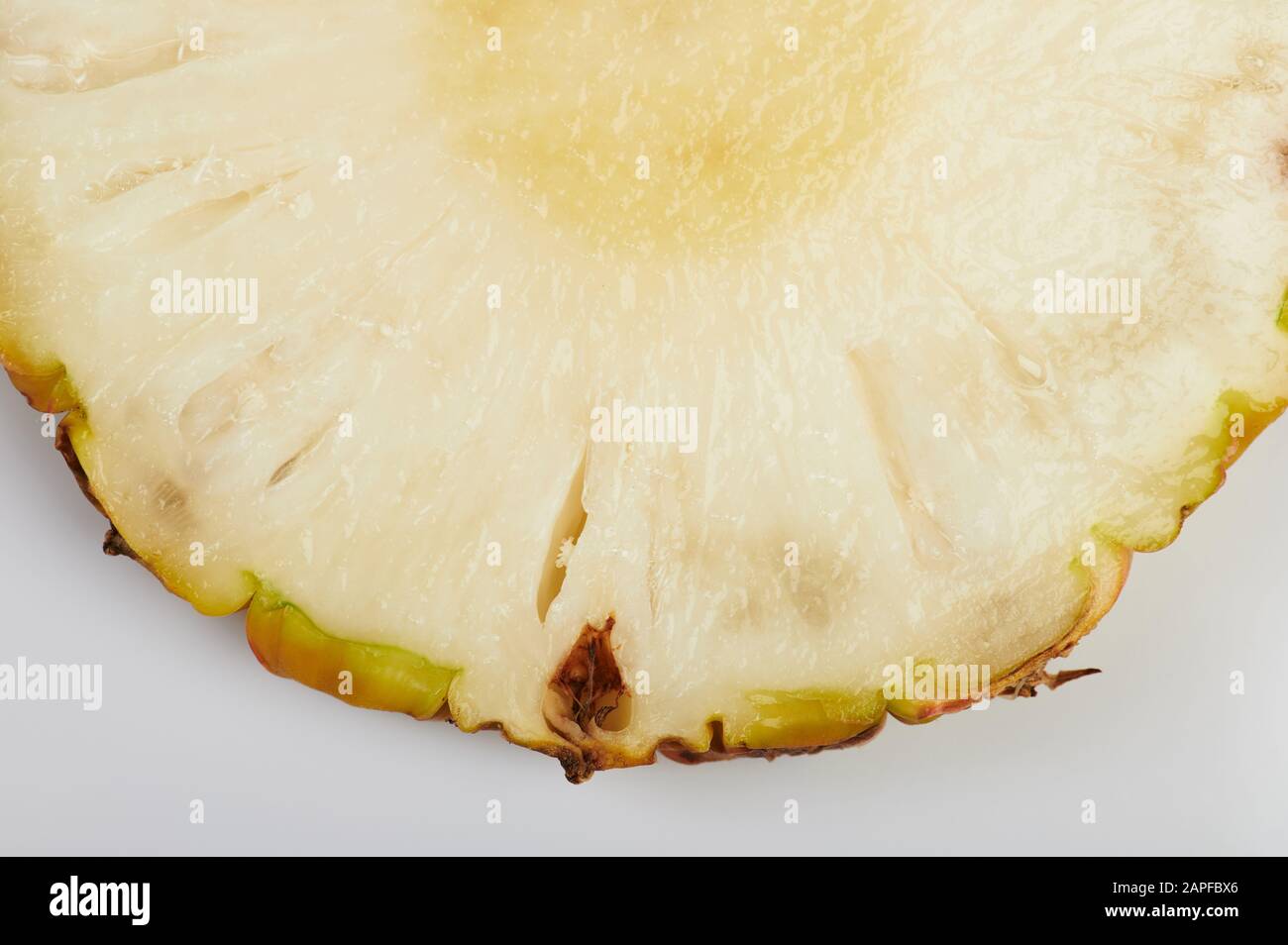 One slice of fresh pineapple isolated close up view Stock Photo