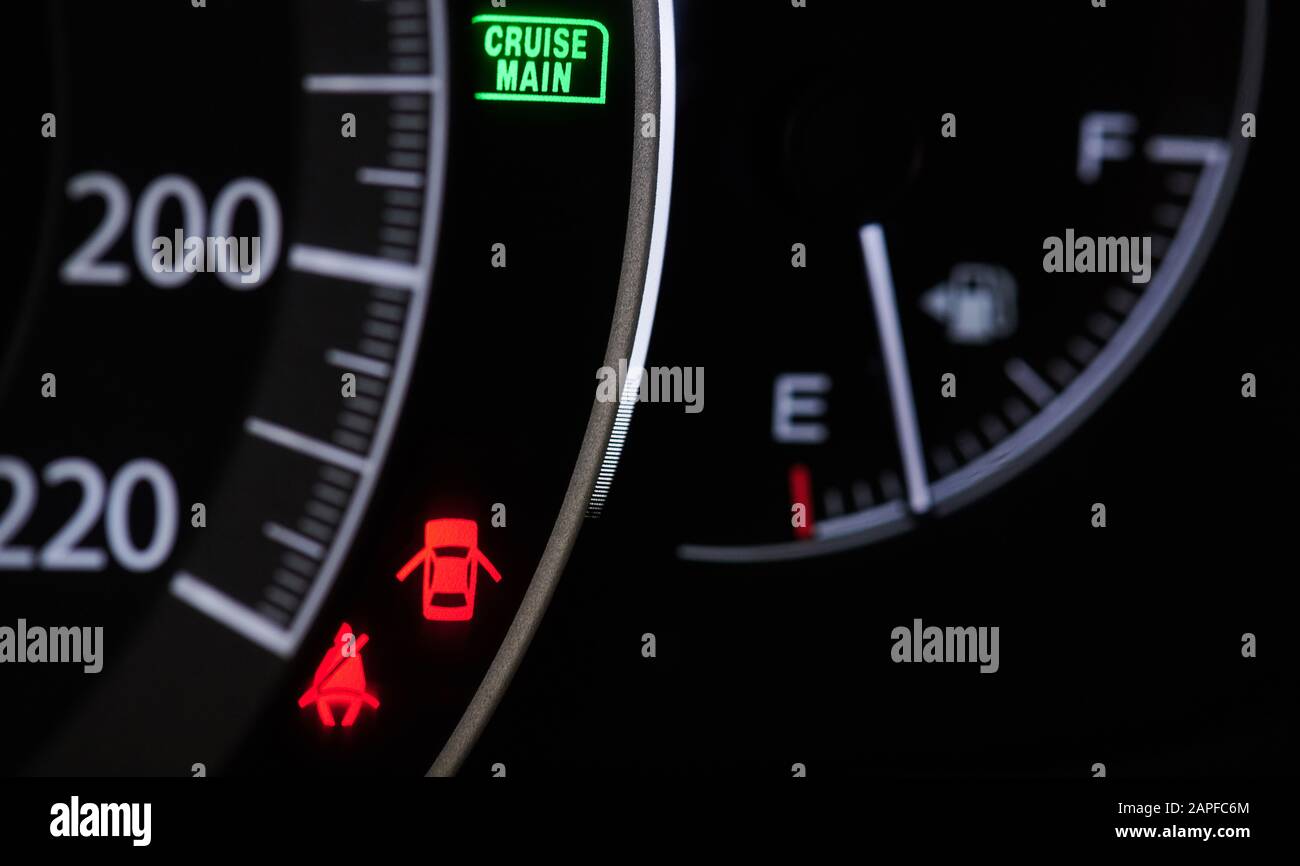 Warning signs on modern car dashboard close up view Stock Photo