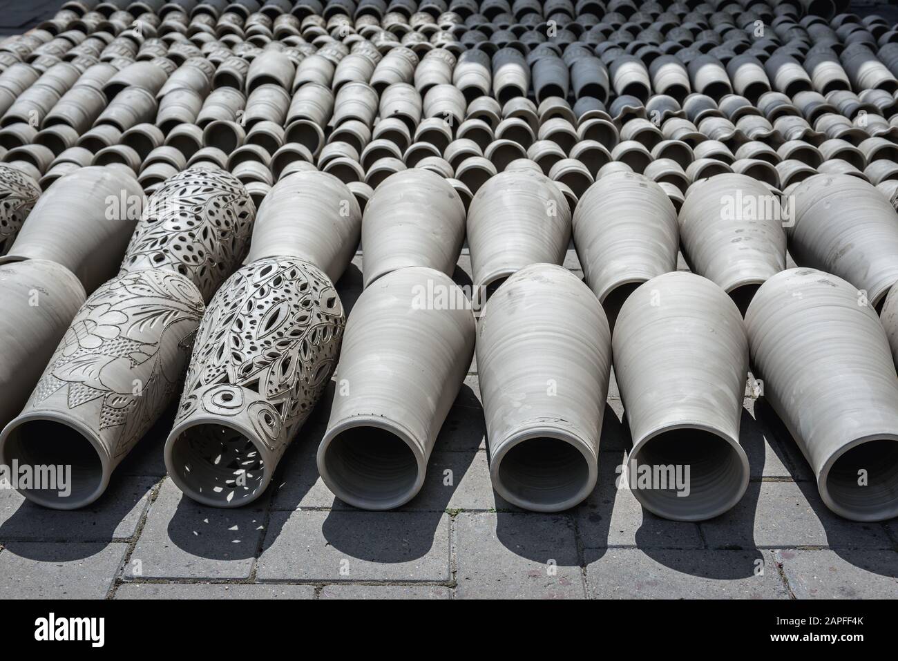 Handmade vases drying on sun in front of Black Ceramics of Marginea centre, famous for its ancient burning technique in Marginea village, Romania Stock Photo