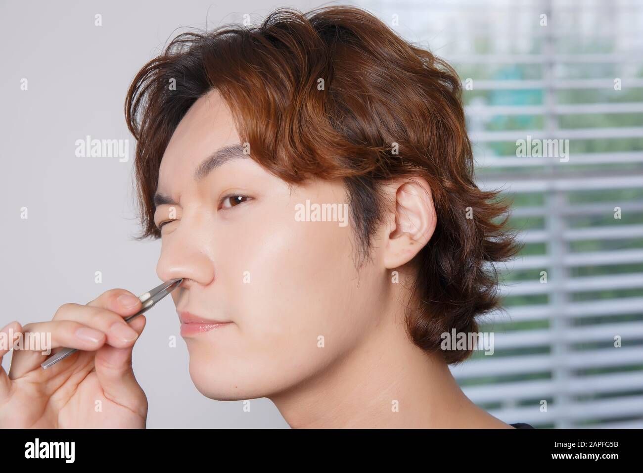 Close-up portrait of attractive young asian man, single man's lifestyle ...