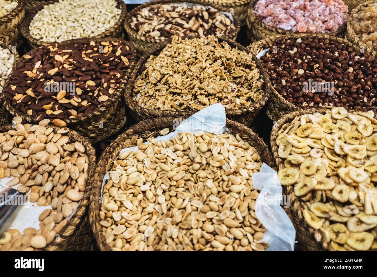 Delicious candied fruits and nuts for sale at a street market Stock
