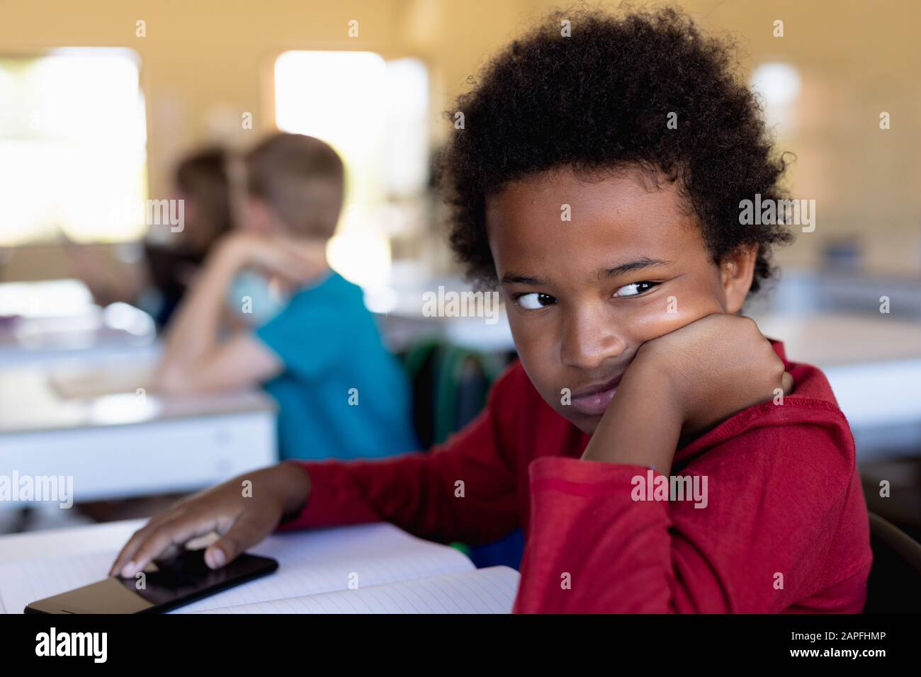Girl looking bored in classroom hi-res stock photography and images - Alamy