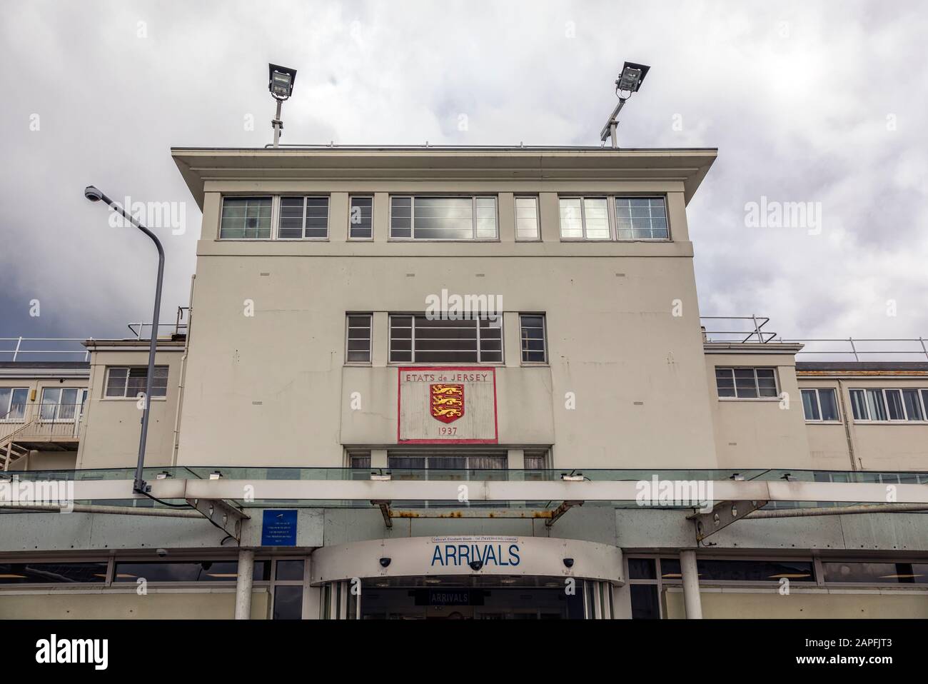JESRSEY, CHANNEL ISLANDS - JUNE 08, 2019:  Arrivals sign on the terminal building at Jersey Airport Stock Photo