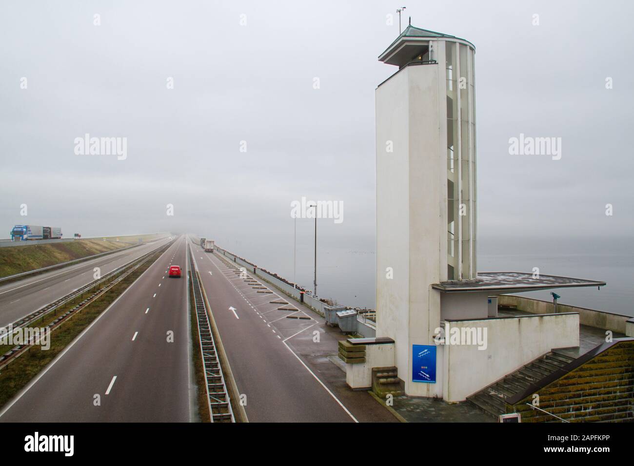 Traffic on the Afsluitdijk, a vast dike between the IJsselmeer en de Waddenzee in the Netherlands Stock Photo