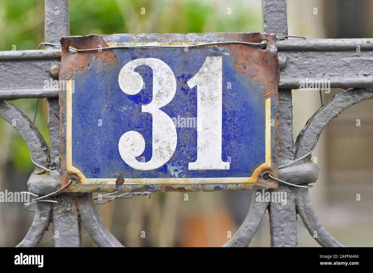 A house number plaque, showing the number thirty one (31) Stock Photo