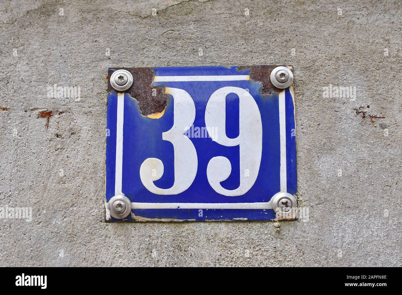 A house number plaque, showing the number thirty nine (39) Stock Photo
