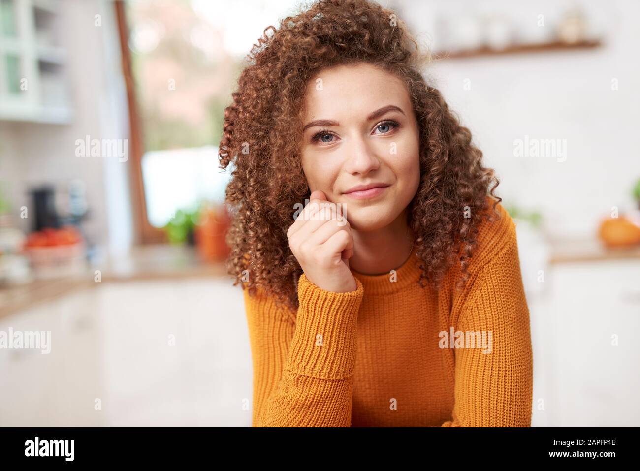 Portrait of smiling young woman Stock Photo