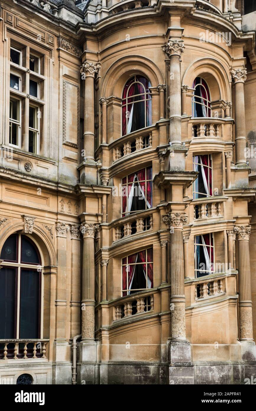 Closeup view of famous spiral staircase seen as an external architectural feature of Waddesdon Manor, former home of Ferdinand Rothschild. Red drapes. Stock Photo