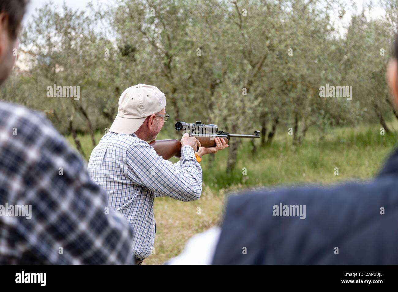 Men at rifle target shooting, Florence, Italy Stock Photo