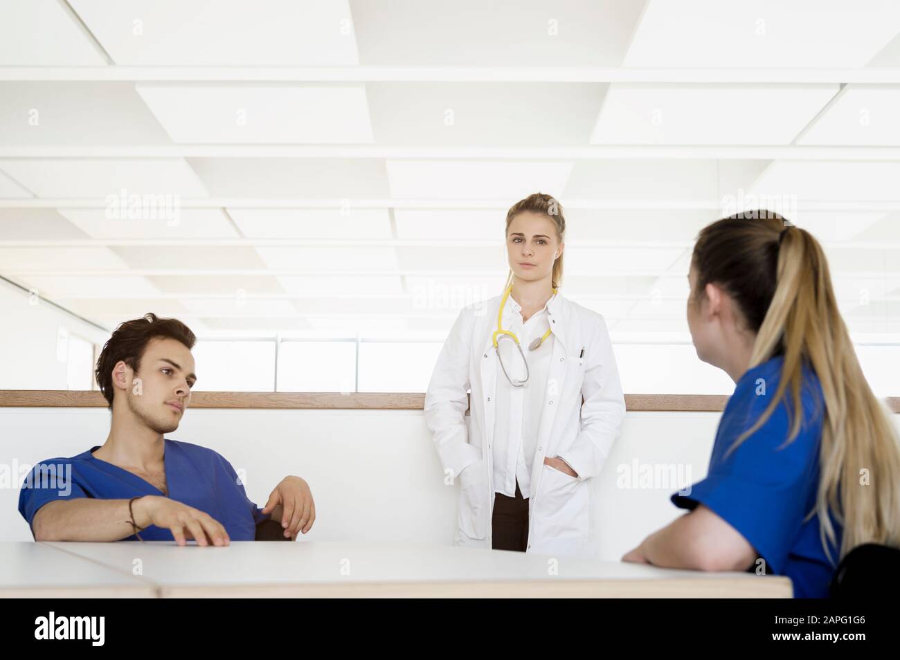 Doctor And Nurses Talking At Corridor In Hospital Stock Photo Alamy