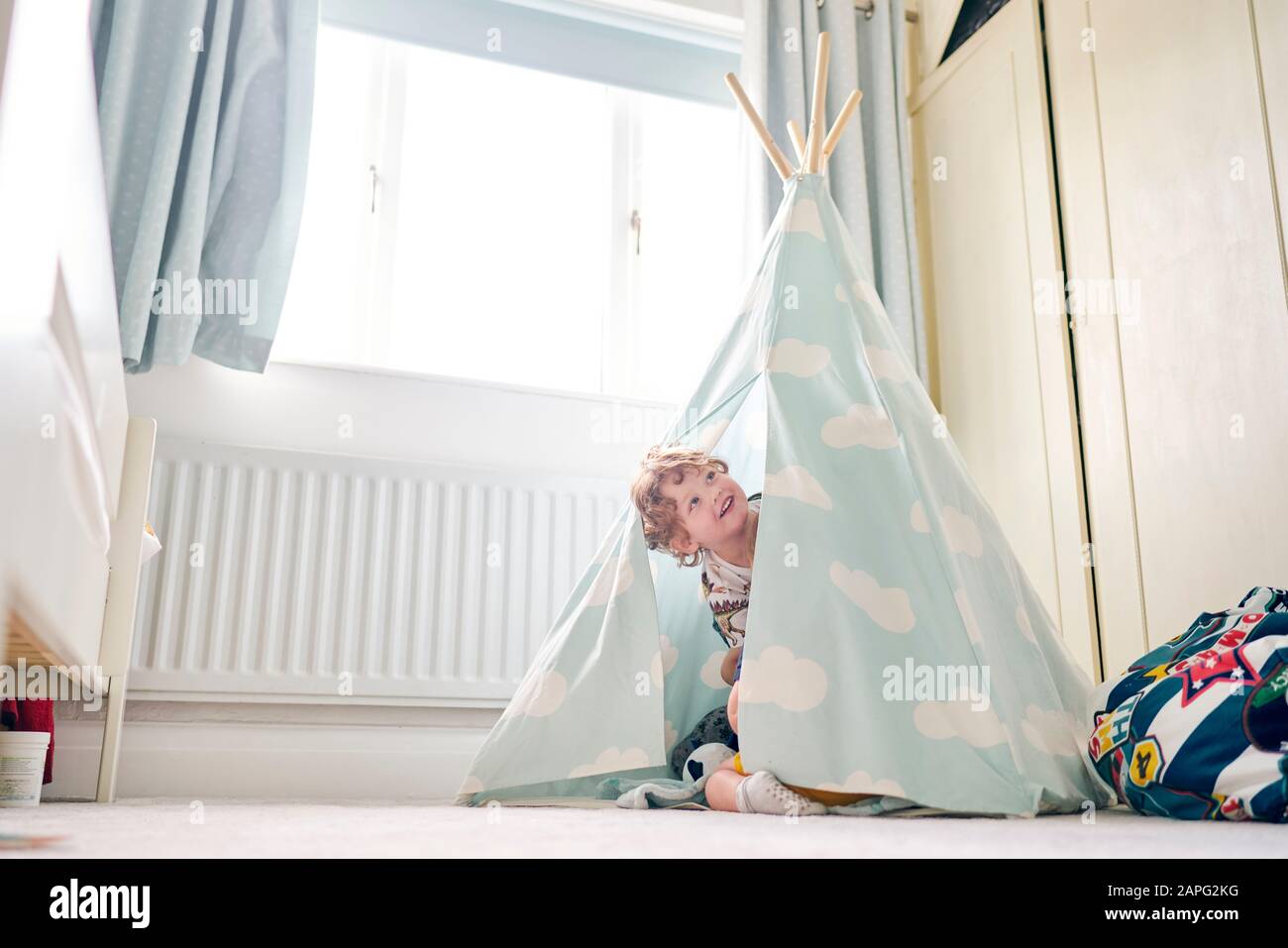 Toddler playing in teepee at home Stock Photo - Alamy