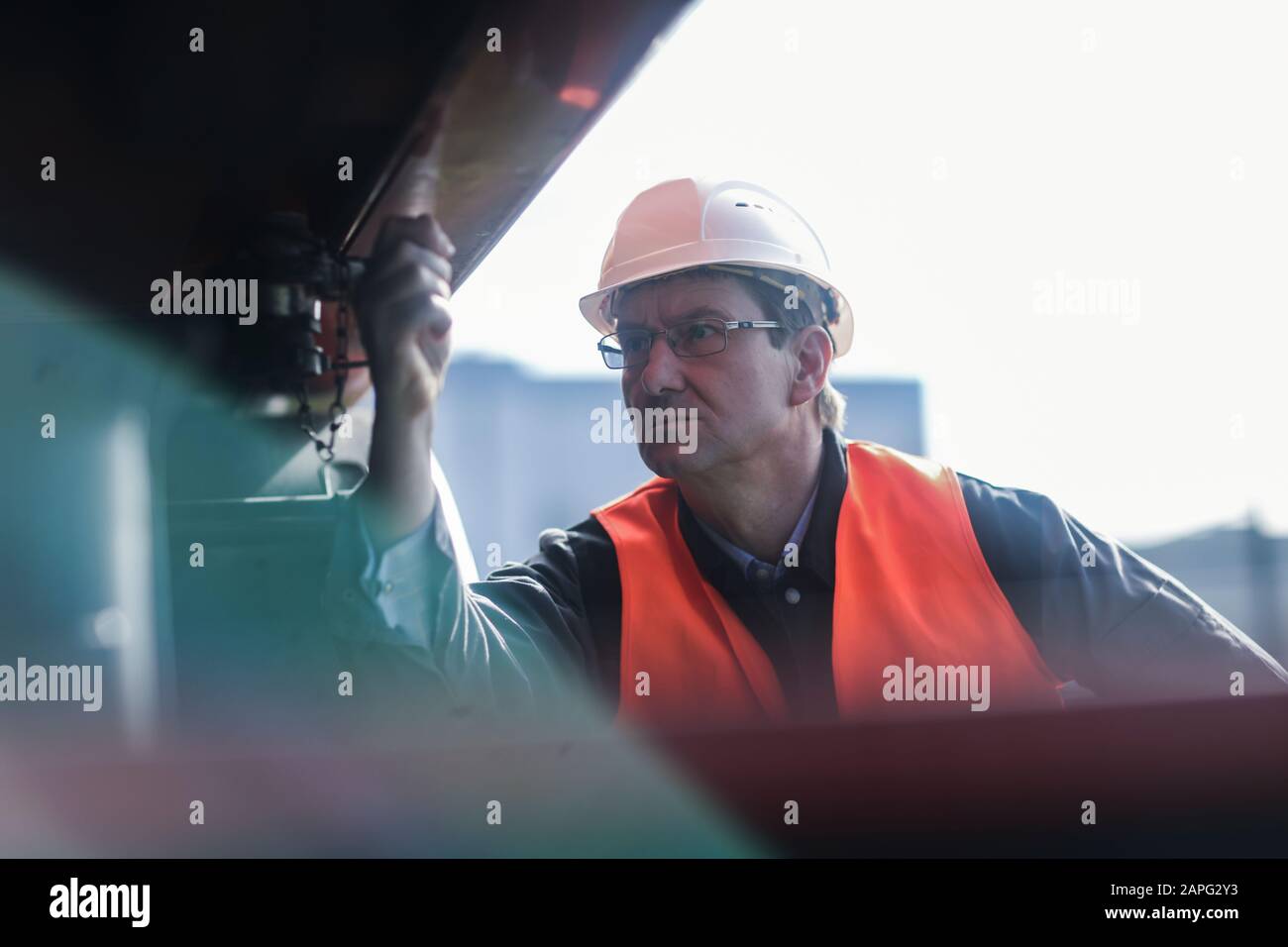 Engineer working at port Stock Photo