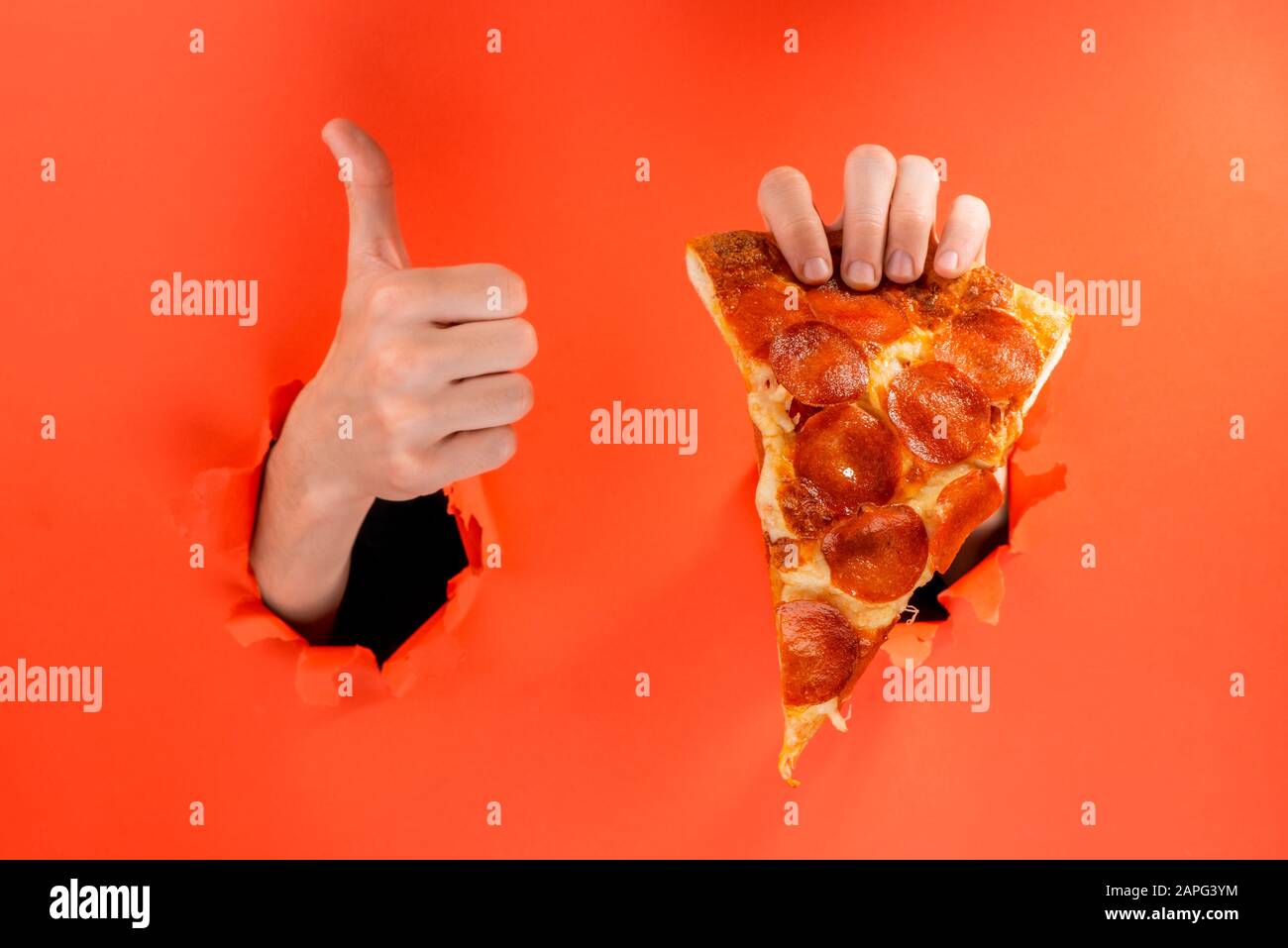 Hand Holding A Pizza Slice And Showing A Thumb Up Stock Photo Alamy