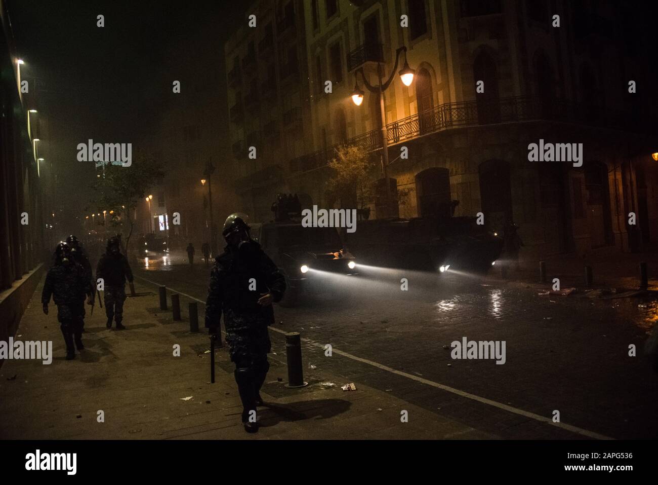 Beirut, Lebanon. 22nd Jan, 2020. Police push back protesters reacting to interim prime minister Hassan Diab's finalisation of a new cabinet for Lebanon, as riots break out in the capital. Credit: Elizabeth Fitt/Alamy Live News Stock Photo