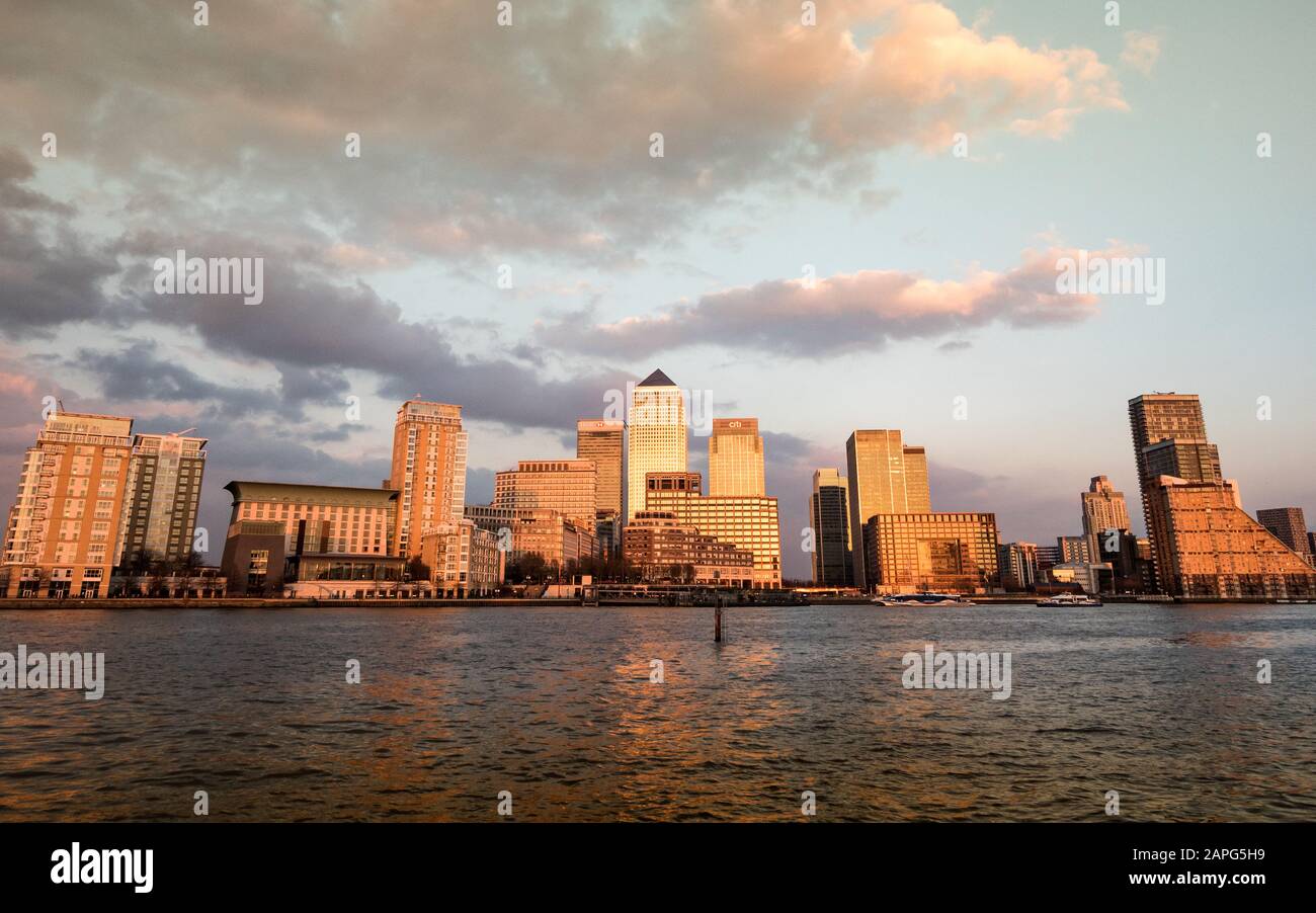 Docklands, London. A dusk view of the waterfront and skyline of the skyscrapers to the Docklands business district in East London. Stock Photo