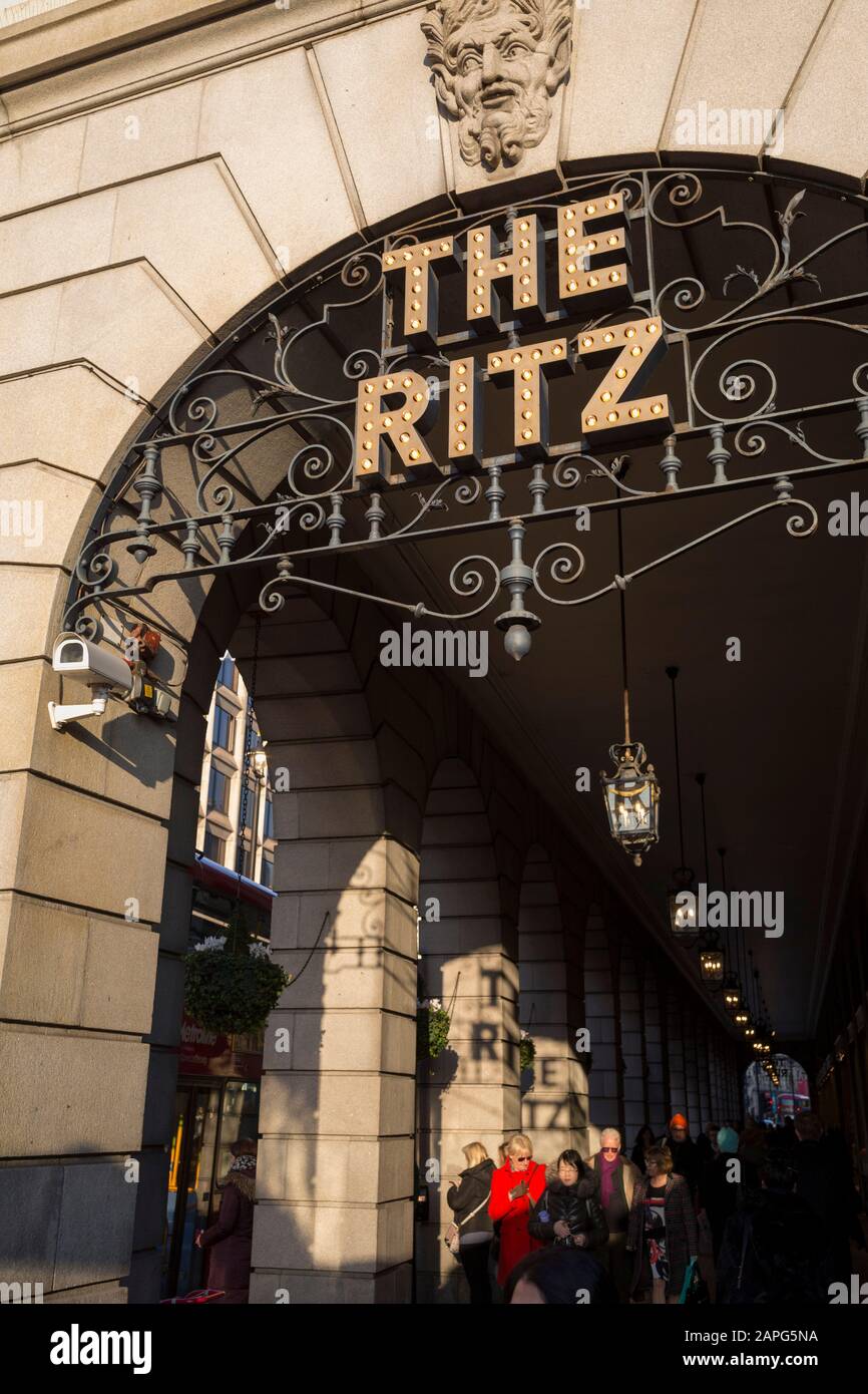 The ironwork and lettering of the Ritz appears as shadows along the pillars of its arcade on Piccadilly, on 21st January 2020, in London, England. Stock Photo