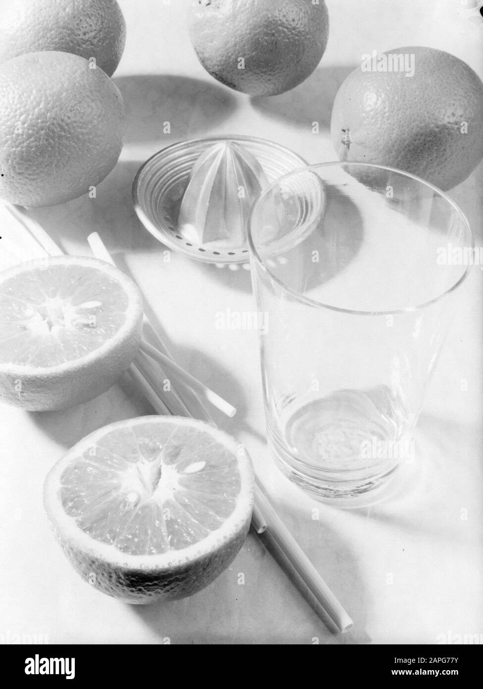 Product photos; glass art Description Citrus fruit, a citrus press, a