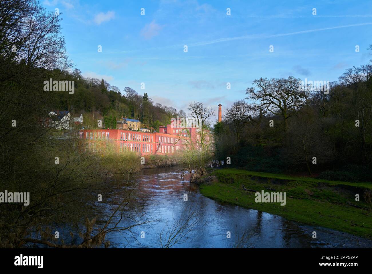 Sir Richard Arkwright’s Masson Mill, a cotton manufacturing mill built in orange red brick in the 18th century beside the river Derwent at Matlock Bat Stock Photo