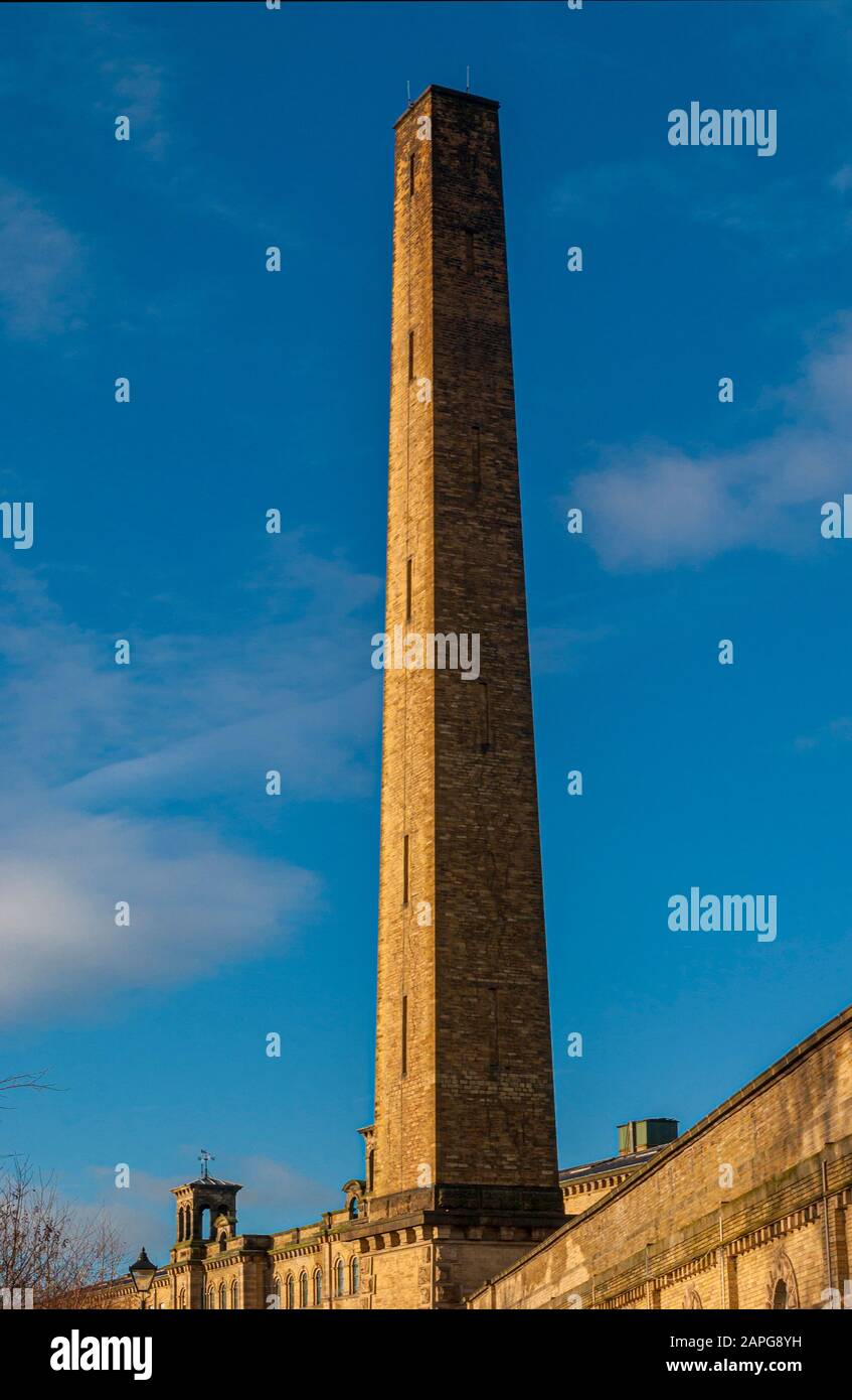 Salts Mill chimney (Listed Grade II)  68 metres high and built of hammer-dressed stone, Saltaire, Yorkshire, UK. Stock Photo