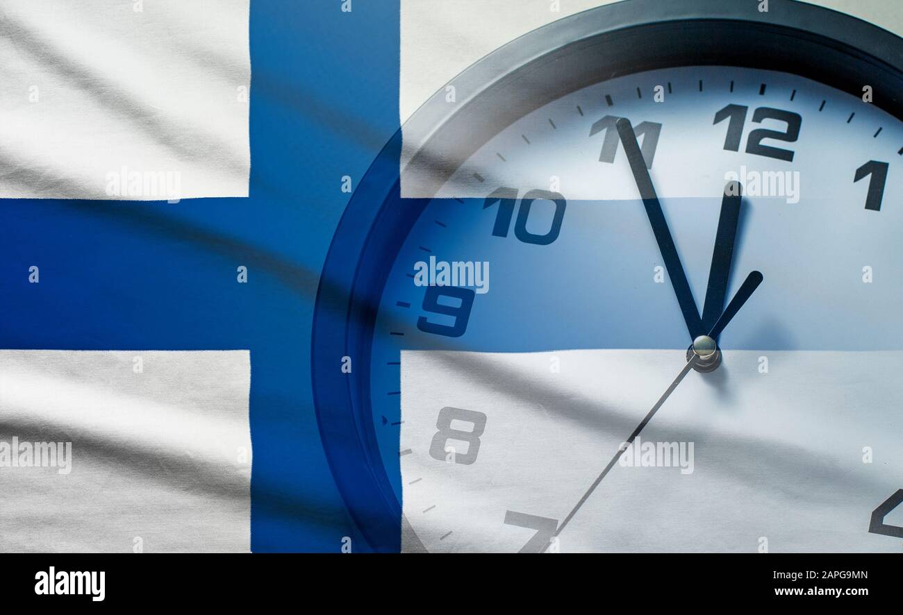 Finland flag with dial of a clock Stock Photo