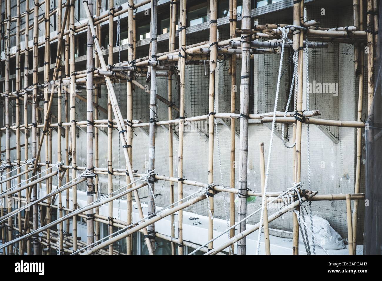 Bamboo scaffolding on building construction site  - Stock Photo