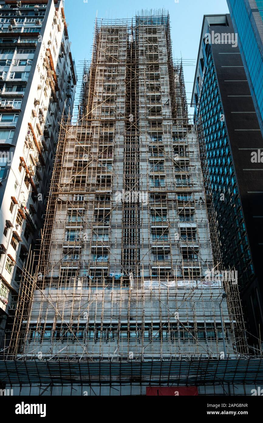 Bamboo scaffolding on building facade, bamboo pole framework, Stock Photo