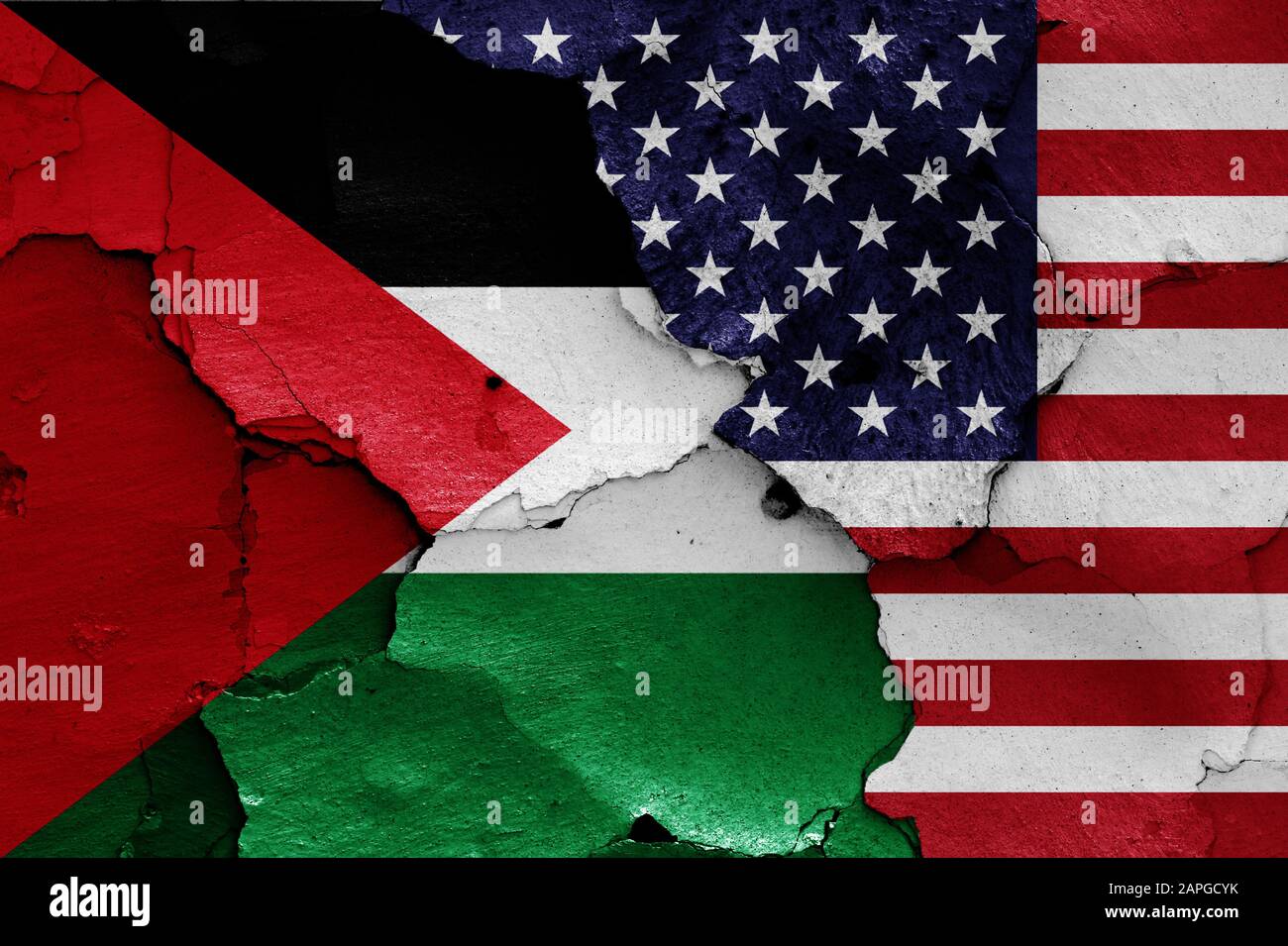 flags of Palestine and USA painted on cracked wall Stock Photo
