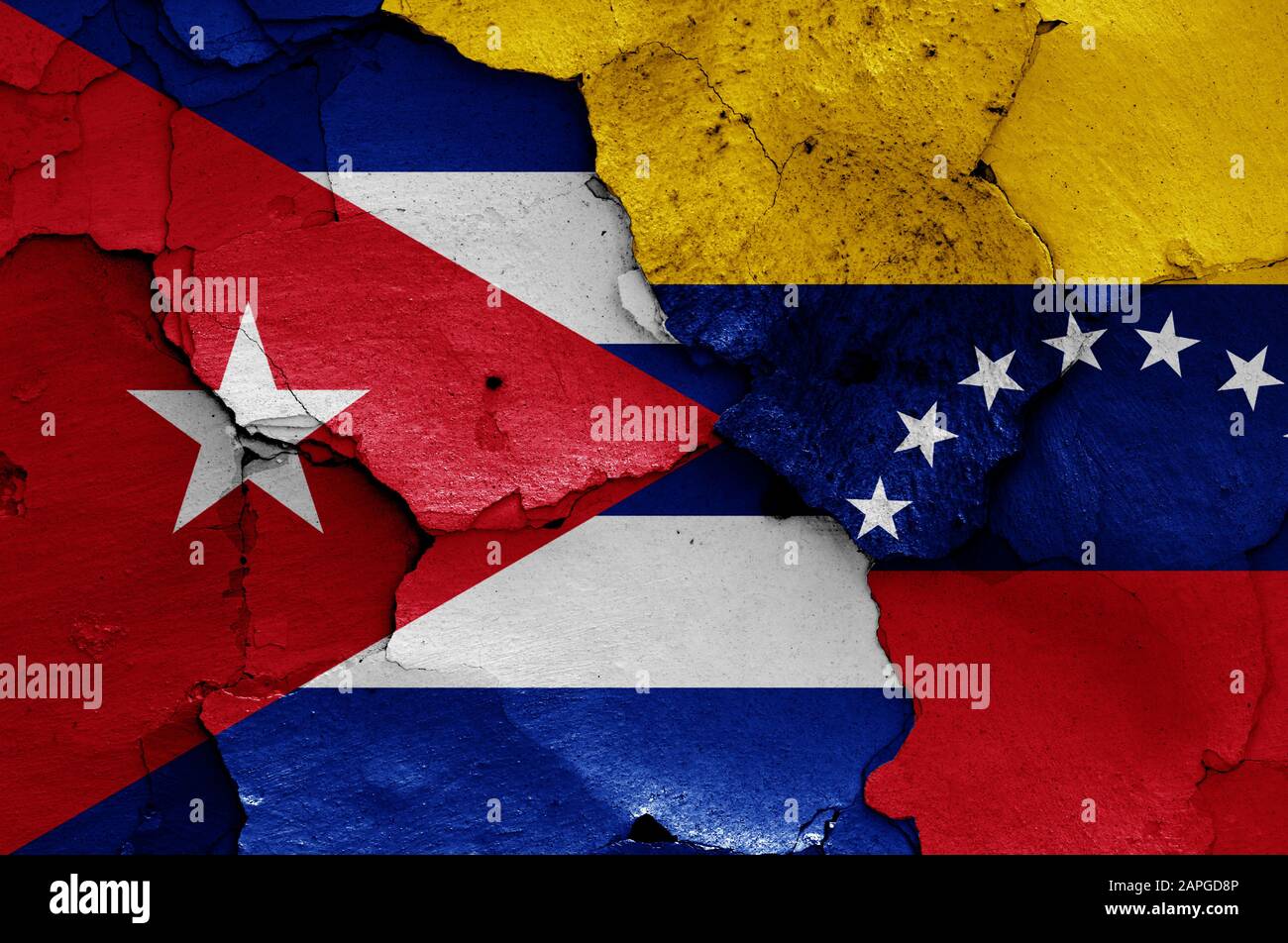 flags of Cuba and Venezuela painted on cracked wall Stock Photo