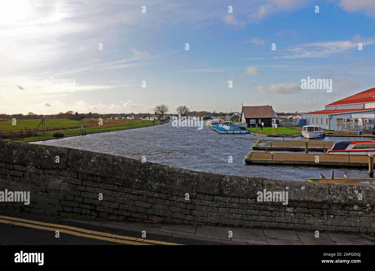A view of the River Thurne on the Norfolk Broads downstream of the old medieval bridge at Potter