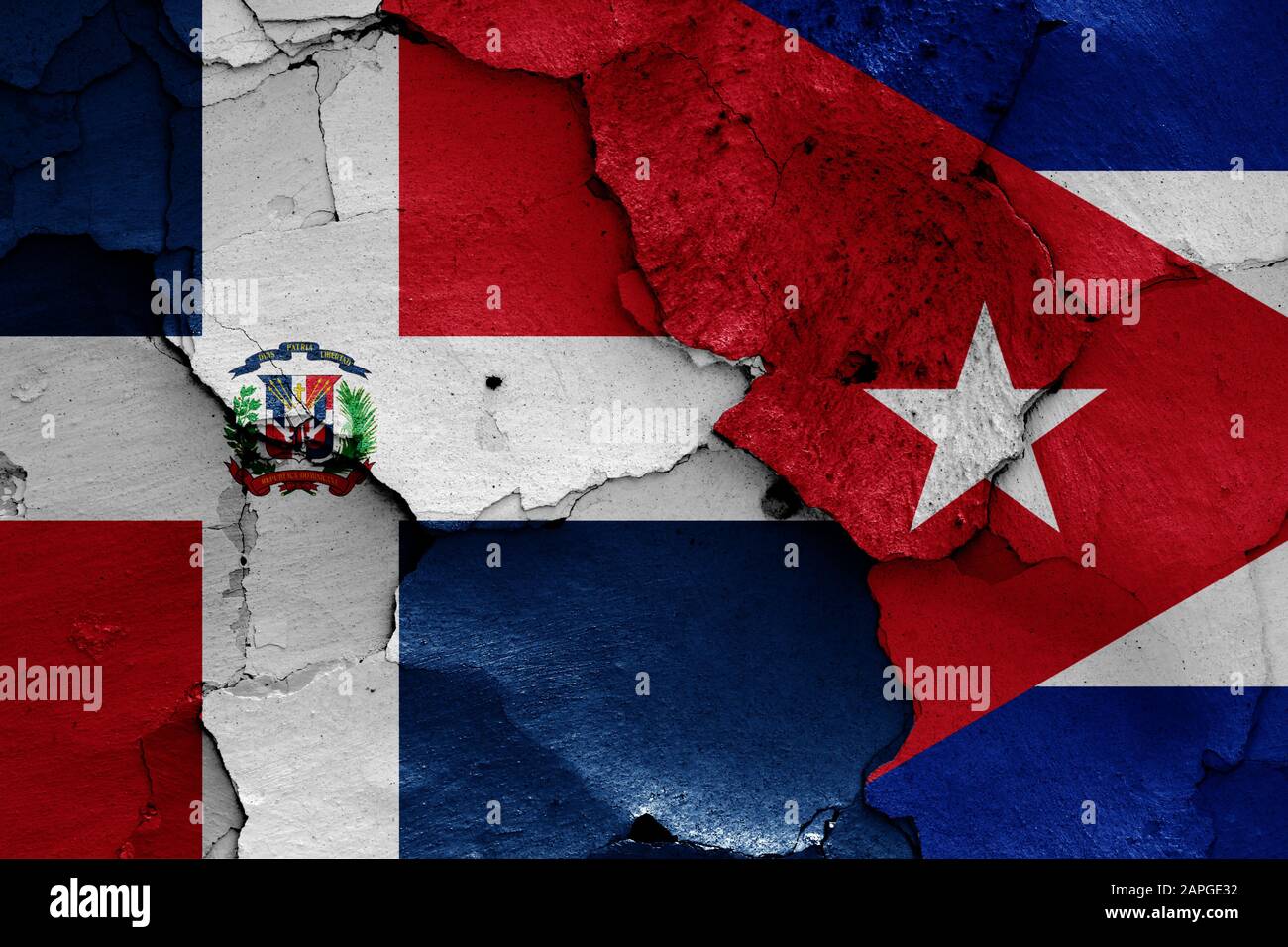 flags of Dominican Republic and Cuba painted on cracked wall Stock Photo