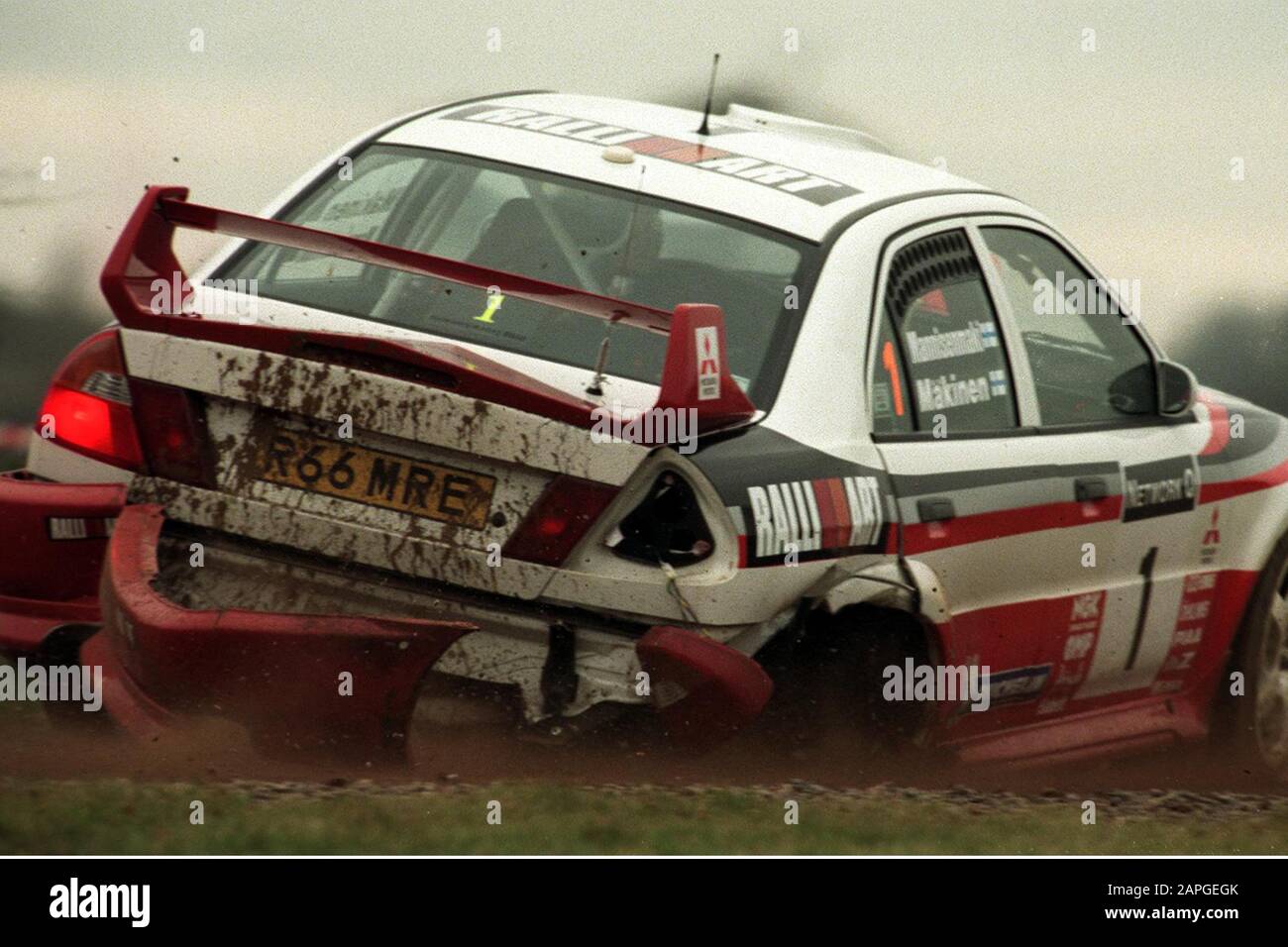 Rally driver Tommi Makinen after his crash on the Milbrook Proving Ground Super Special Stage in his Mitsubishi Rally Car during the 1998 Rally GB  Picture by Antony Thompson - Thousand Word Media, NO SALES, NO SYNDICATION. Contact for more information mob: 07775556610 web: www.thousandwordmedia.com email: antony@thousandwordmedia.com  The photographic copyright (© 2020) is exclusively retained by the works creator at all times and sales, syndication or offering the work for future publication to a third party without the photographer's knowledge or agreement is in breach of the Copyright Desi Stock Photo