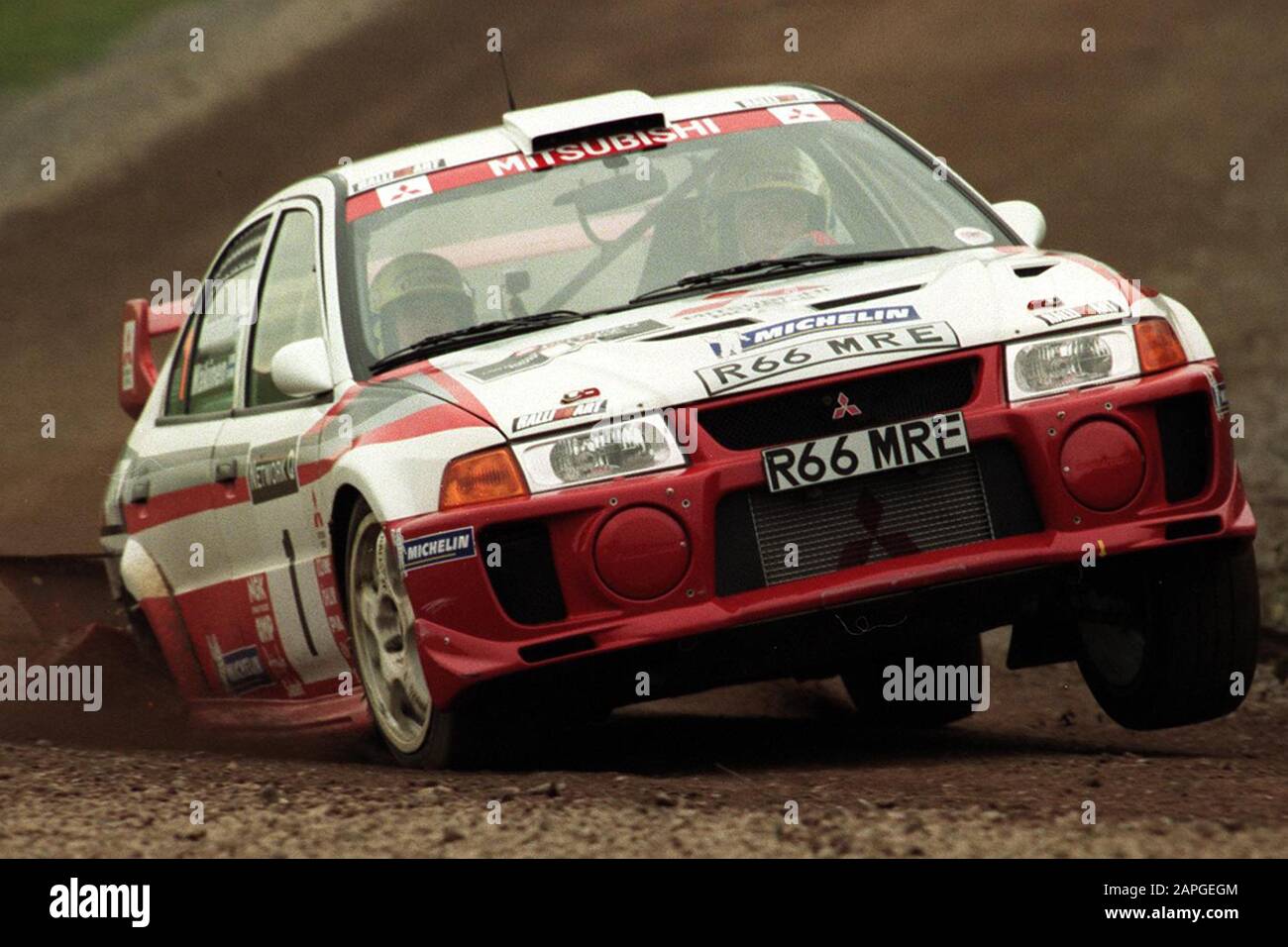 Rally driver Tommi Makinen after his crash on the Milbrook Proving Ground Super Special Stage in his Mitsubishi Rally Car during the 1998 Rally GB  Picture by Antony Thompson - Thousand Word Media, NO SALES, NO SYNDICATION. Contact for more information mob: 07775556610 web: www.thousandwordmedia.com email: antony@thousandwordmedia.com  The photographic copyright (© 2020) is exclusively retained by the works creator at all times and sales, syndication or offering the work for future publication to a third party without the photographer's knowledge or agreement is in breach of the Copyright Desi Stock Photo