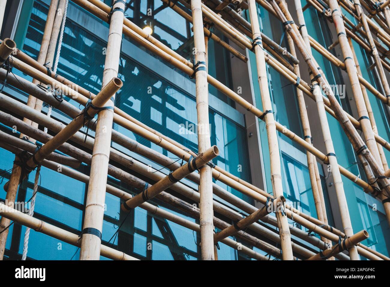 Bamboo scaffolding on building construction site  - Stock Photo