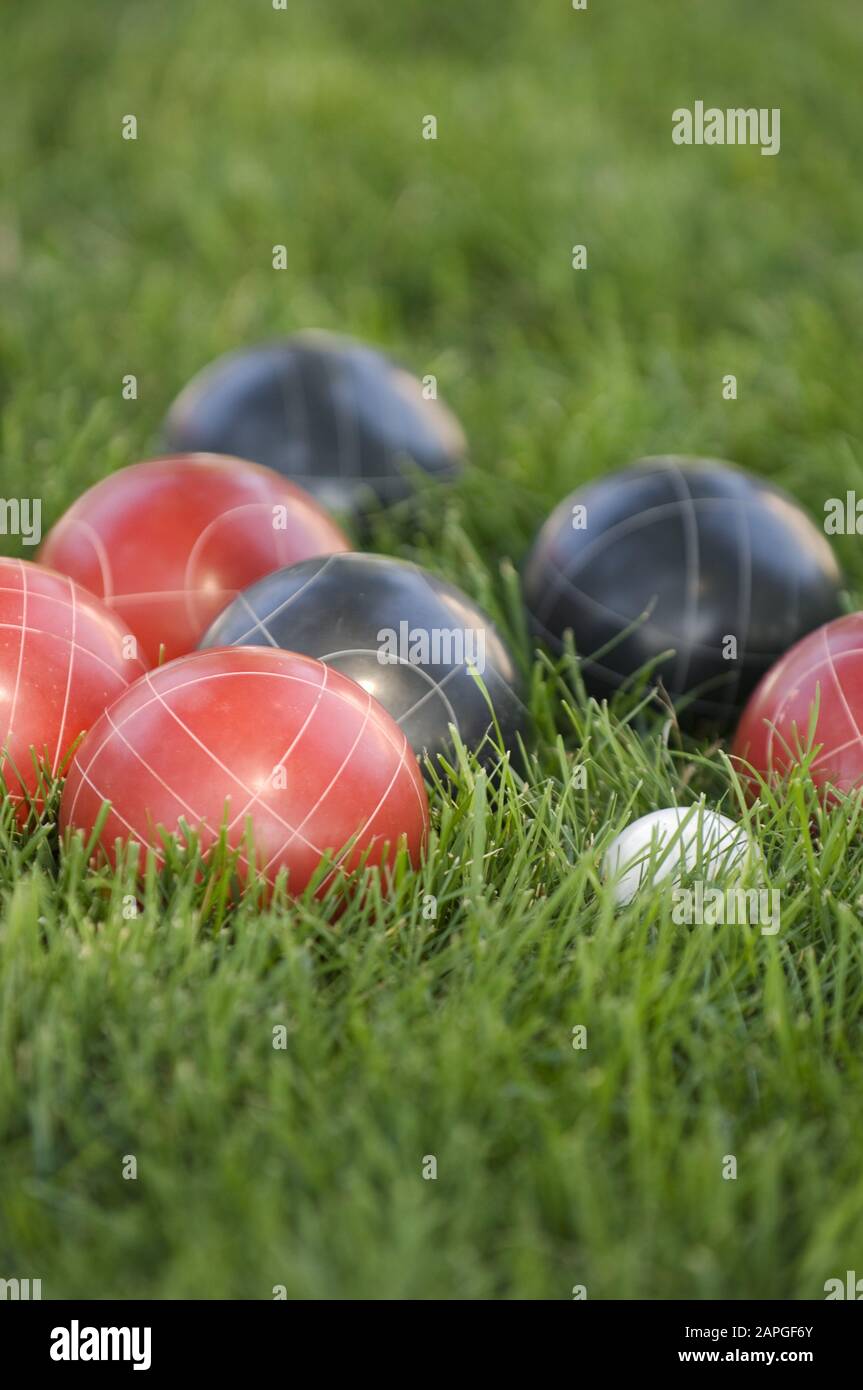 Petanque game play grass ball balls competition hires stock