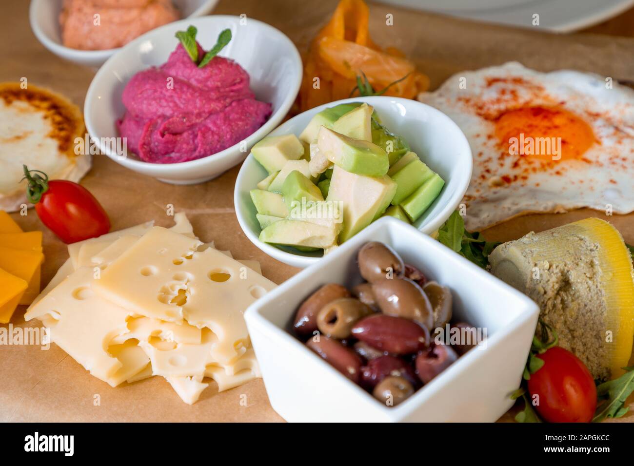 Restaurant table with variety of foods and beverages. Stock Photo