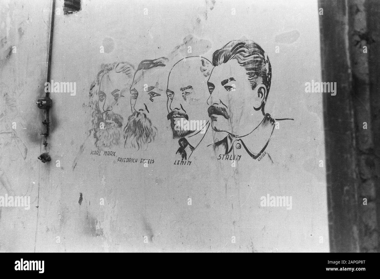 Garoet Description: Communist raffiti on a wall. The headlines of Marx, Engels, Lenin and Stalin Date: September 1947 Location: Indonesia, Dutch East Indies Stock Photo