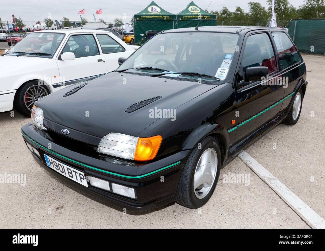 Three-quarter front view of a Black, 1990, Ford Fiesta RS Turbo, on display at the 2019 Silverstone Classic Stock Photo