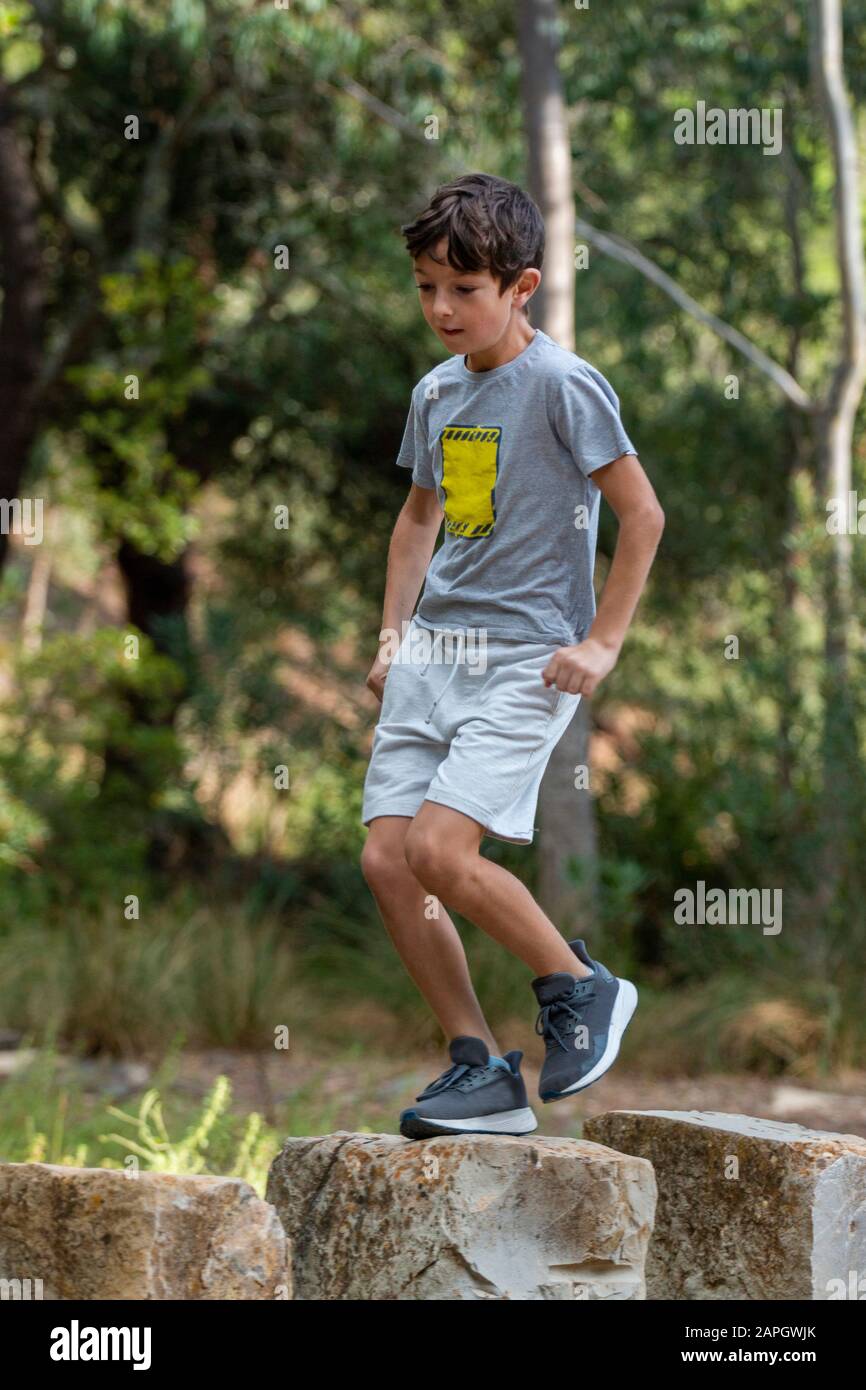 Cute boy in sport clothing running Stock Photo Alamy