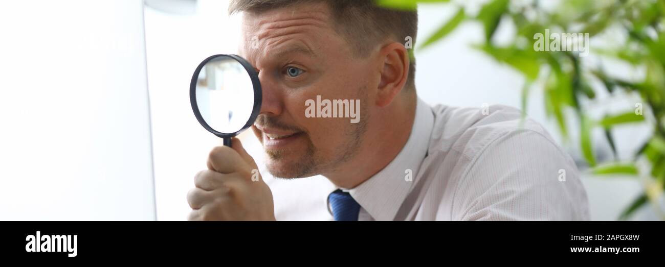 Man sitting at workplace Stock Photo