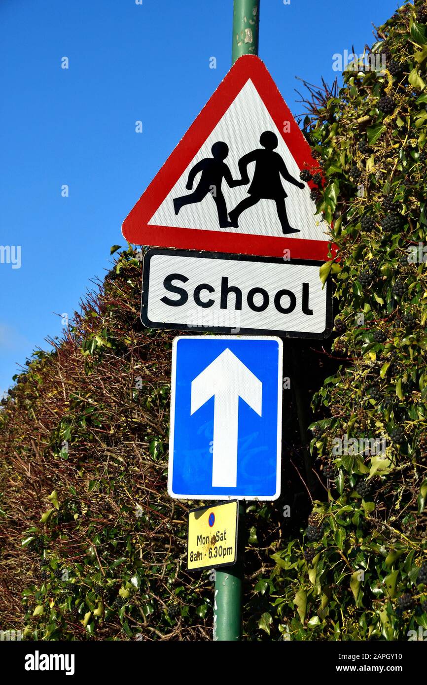 Maidstone, Kent, UK. Street signs: one way raod outside a school Stock Photo